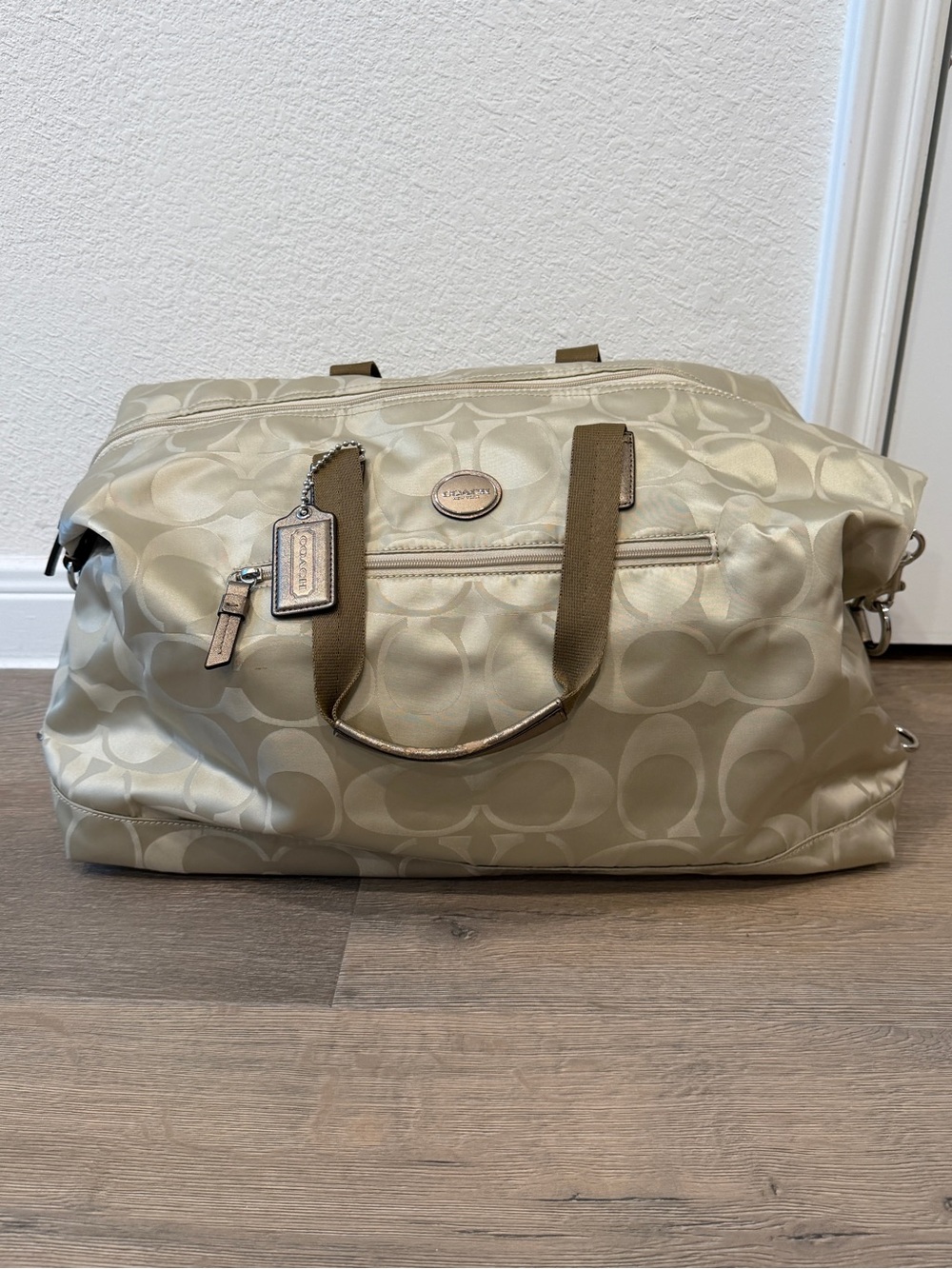 Coach monogram duffle bag gold